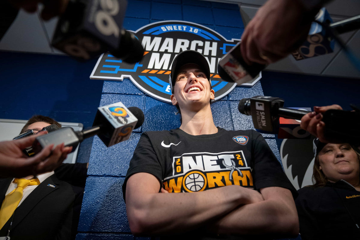 Iowa Hawkeyes guard Caitlin Clark (22) speaks with reporters in the locker room after beating LSU in the Elite 8round of the NCAA Women's Basketball Tournament between Iowa and LSU at MVP Arena, April 1, 2024, in Albany, N.Y. Zach Boyden-Holmes / Des Moines Register