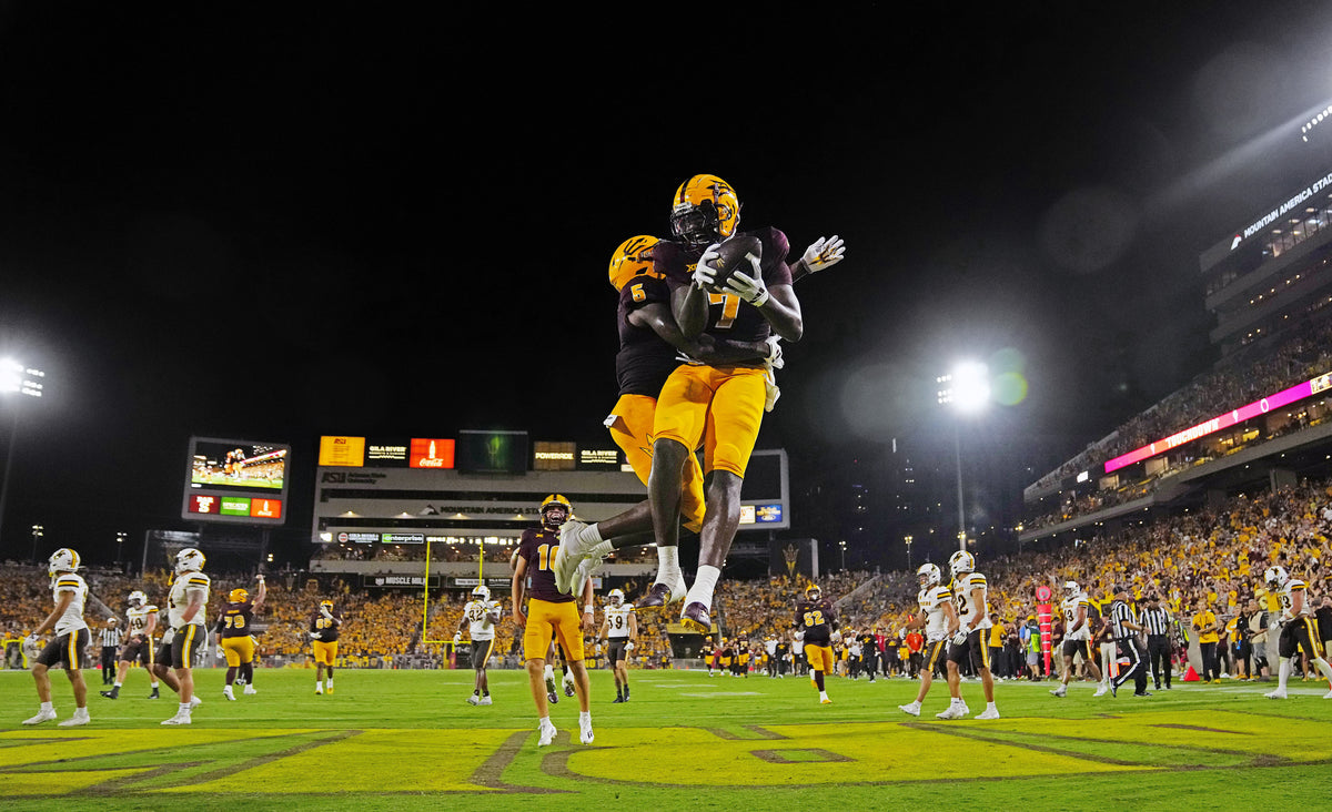 Arizona State tight end Chamon Metayer (7) and wide receiver Melquan Stovall (5) celebrate Metayer’s 25-yard touchdown reception early in the third quarter. It boosted the Sun Devils’ lead over Wyoming in the season opener to 34-0.  Patrick Breen / The Republic