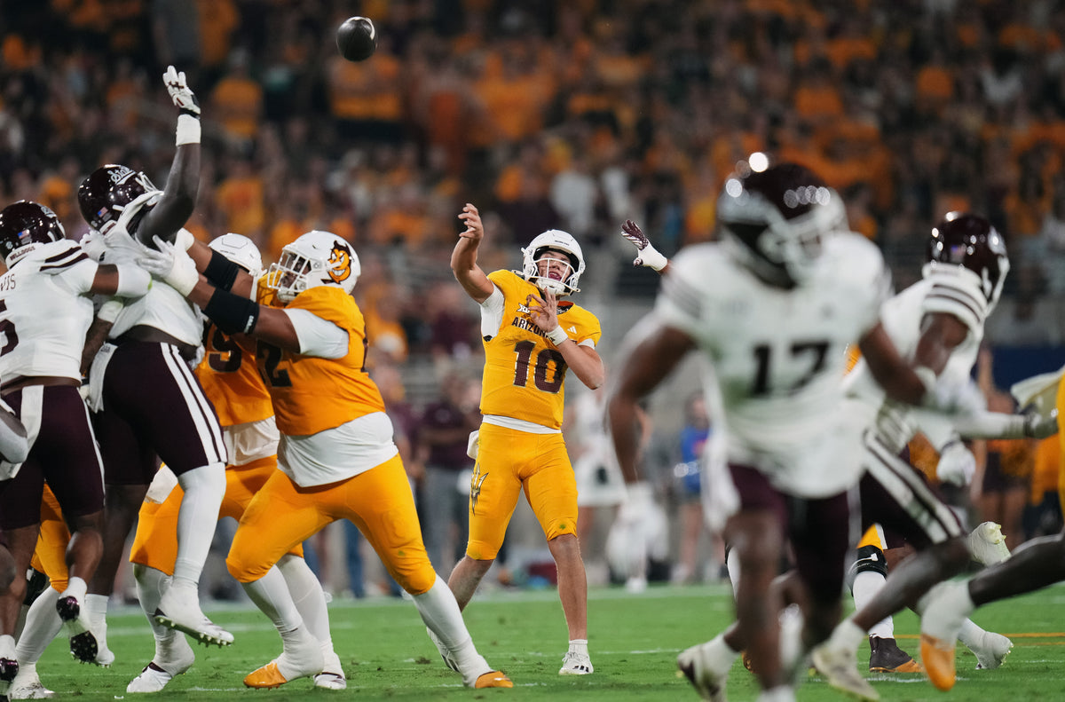 Sun Devils quarterback Sam Leavitt delivers a pass with perfect protection. After a dazzling debut, Leavitt completed only 10 of 20 passes for 69 yards. He did run 11 times for 62 yards and two touchdowns.  Joe Rondone / The Republic