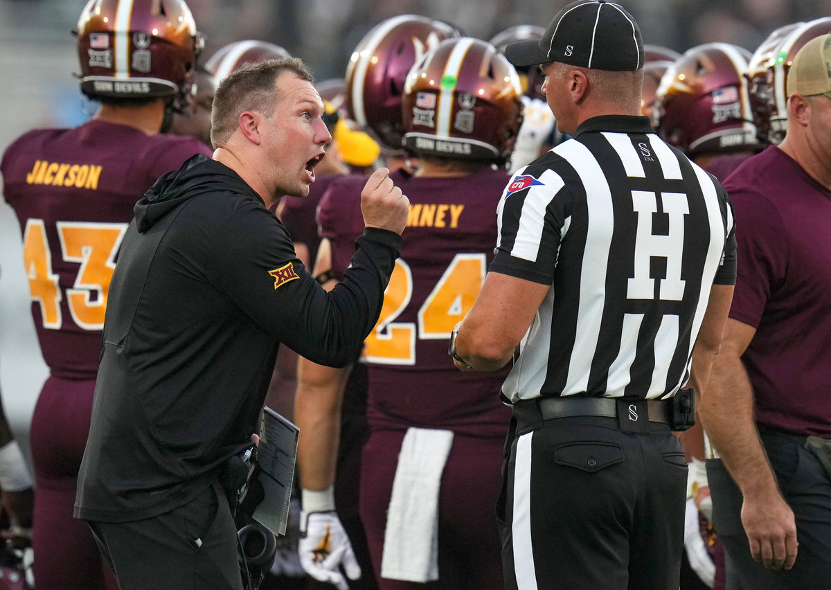 Arizona State coach Kenny Dillingham points to make his point to the head linesman. The Sun Devils were penalized eight times for 70 yards; the Jayhawks were flagged six times for 55 yards.  Joe Rondone / The Republic
