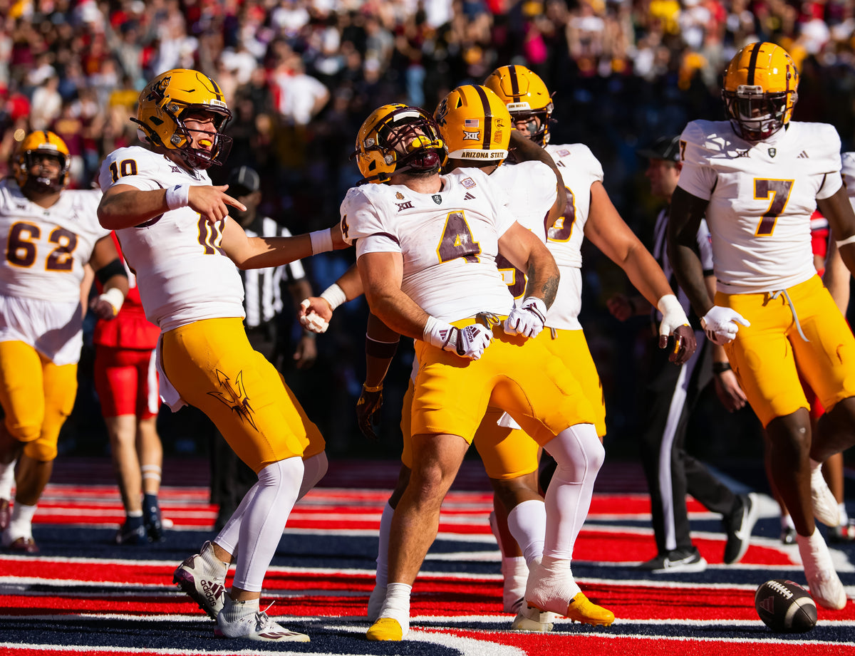 Quarterback Sam Leavitt (10) celebrates in the end zone with Cam Skattebo (4) during ASU’s rout of the Wildcats in the Territorial Cup at Arizona Stadium. For the second straight game, Skattebo scored three touchdowns in the first half.  Mark J. Rebilas / Imagn Images