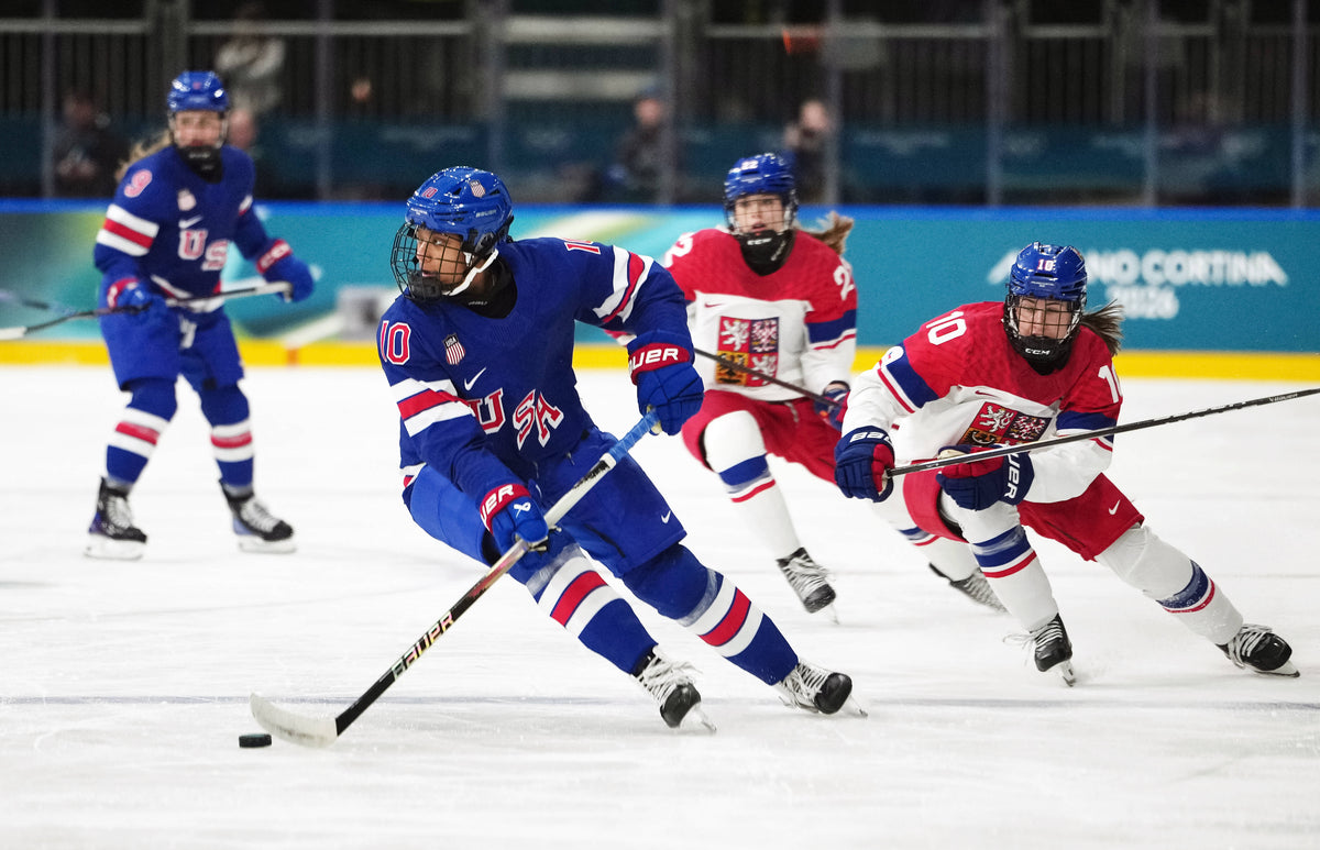 Laila Edwards (10) of Team United States skates with the puck against Denisa Krizova (10) of Team Czechia in women's ice hockey Group A play during the Milano Cortina 2026 Olympic Winter Games at Milano Rho Ice Hockey Arena. James Lang / Imagn Images