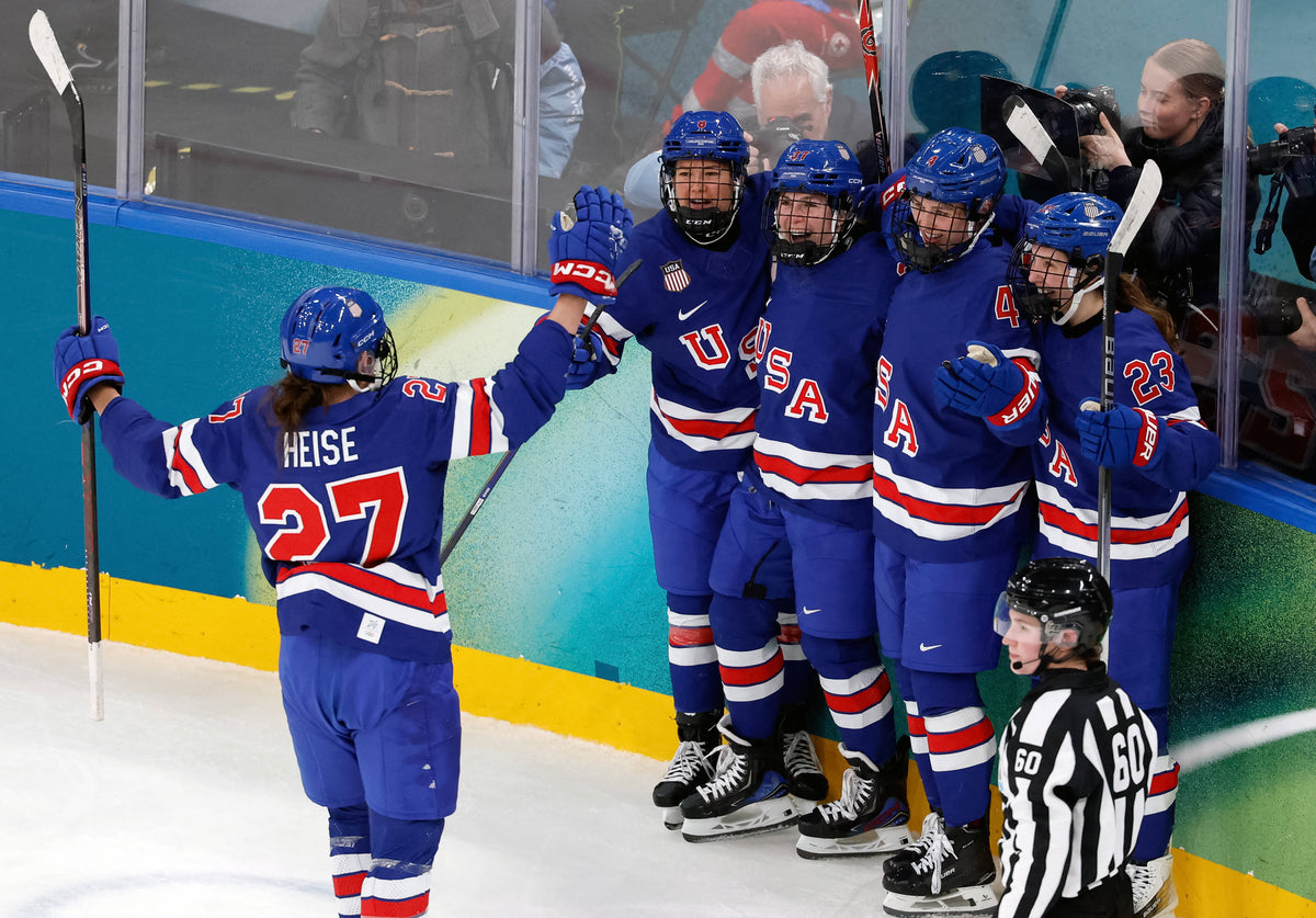 Abbey Murphy of United States celebrates with teammates after scoring their third goal  against Sweden in a women's ice hockey semifinal during the Milano Cortina 2026 Olympic Winter Games at Milano Santagiulia Ice Hockey Arena. David W Cerny / Reuters via Imagn Images