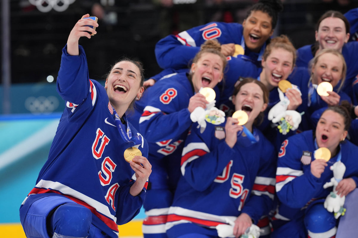 Team USA takes a selfie with their gold medals after defeating Canada in the women's ice hockey gold medal game during the Milano Cortina 2026 Olympic Winter Games at Milano Santagiulia Ice Hockey Arena. Amber Searls / Imagn Images