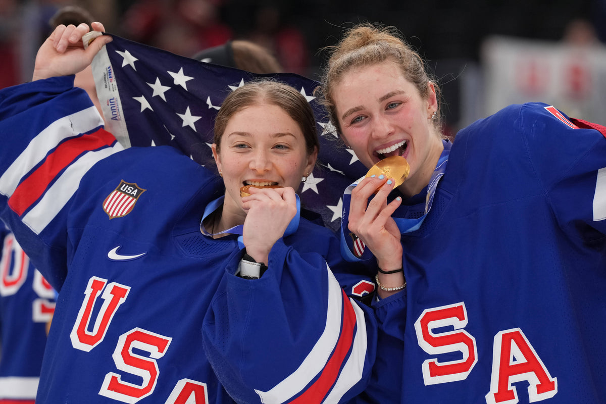 Aerin Frankel (31) of the United States and Caroline Harvey (4) of the United States celebrate after winning the gold medal in women's ice hockey after defeating Canada during the Milano Cortina 2026 Olympic Winter Games at Milano Santagiulia Ice Hockey Arena. Amber Searls-Imagn Images
