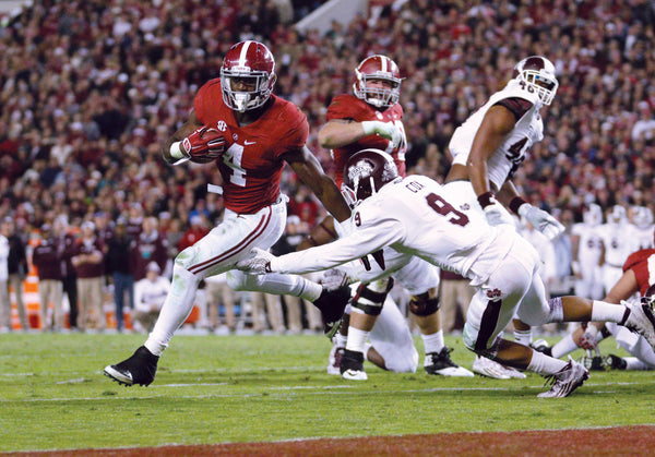 Alabama Crimson Tide running back T.J. Yeldon (4) carries the past Mississippi State Bulldogs defensive back Justin Cox (9) for a touchdown in the fourth quarter at Bryant-Denny Stadium. Marvin Gentry / USA TODAY Sports