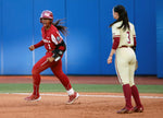 Oklahoma’s Cydney Sanders (1) celebrates her home run as she rounds the bases next to Florida State’s Bethaney Keen (3) in the fifth inning during the second game of the Women’s College World Championship Series between the Oklahoma Sooners and Florida State at USA Softball Hall of Fame Stadium in Oklahoma City, June 8, 2023. SARAH PHIPPS / THE OKLAHOMAN