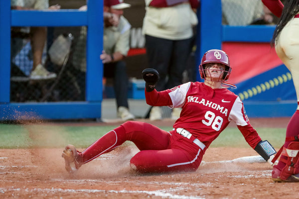Oklahoma pitcher Jordy Bahl (98) slides into home in the sixth inning during the second game of the Women’s College World Series finals between Oklahoma and Florida State at USA Softball Hall of Fame Stadium in Oklahoma City on June 8, 2023. NATHAN J. FISH / THE OKLAHOMAN