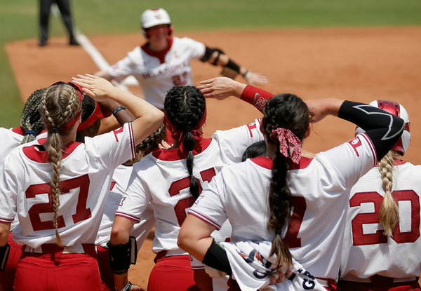 Oklahoma celebrates Lynnsie Elam’s home run in the first inning of the Big 12 softball tournament game between the Oklahoma and Iowa State at the USA Softball Hall of Fame Stadium in Oklahoma City, May 13, 2022. SARAH PHIPPS / THE OKLAHOMAN