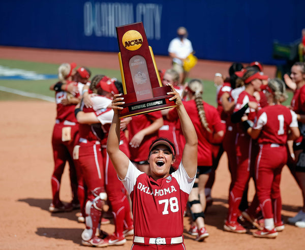 Oklahoma’s Jocelyn Alo (78) holds up the championship trophy following the final game of Women’s College World Series championship series between OU and Florida State at USA Softball Hall of Fame Stadium in Oklahoma City, June 10, 2021. Oklahoma won 6-2. SARAH PHIPPS / THE OKLAHOMAN
