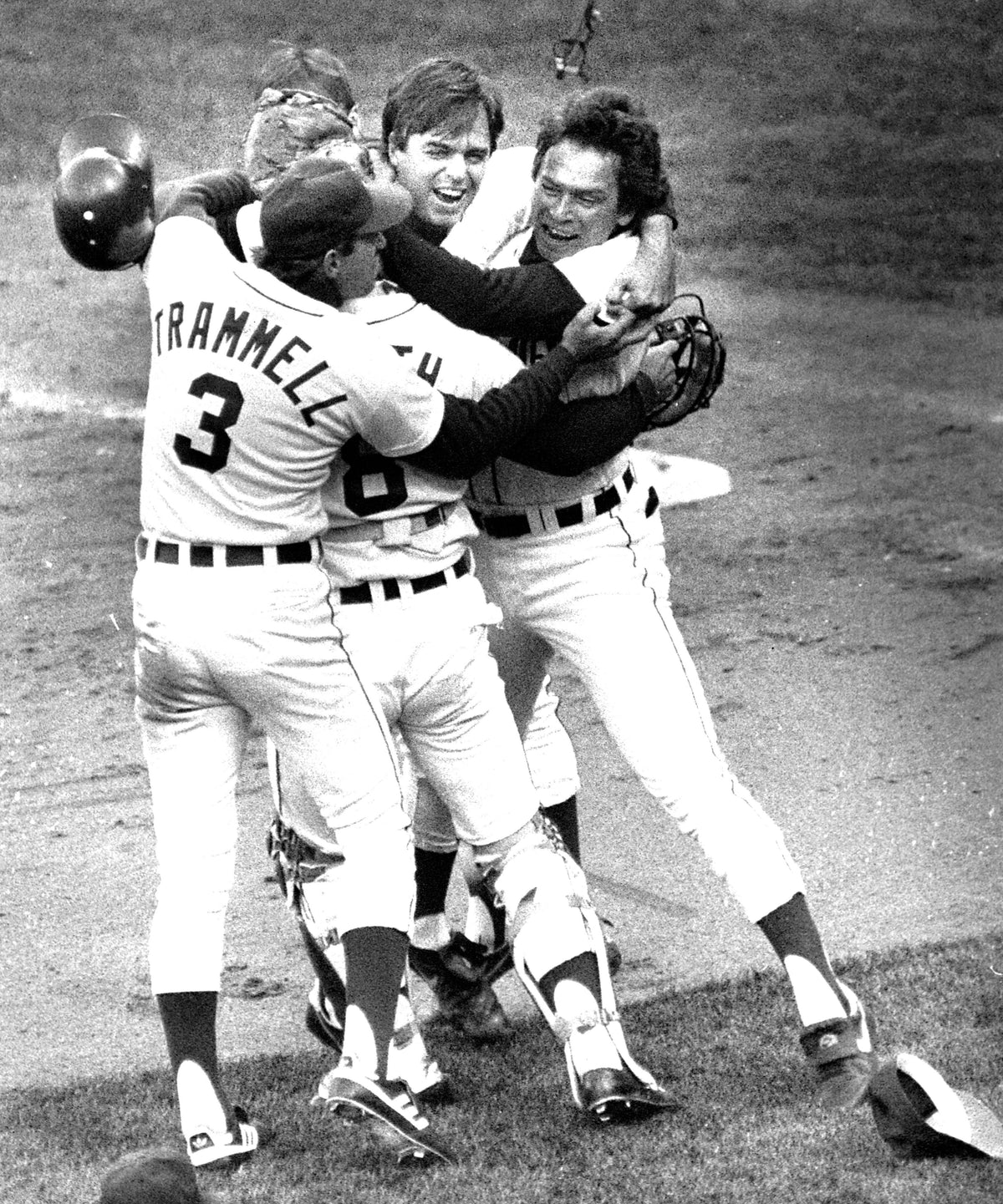 Detroit Tigers 1984 World Series - Trammell, Tanana and Evans (left to right) (joined by Heath, whose back is to camera) hug as they celebrate after defeating Toronto 1-0. Detroit Free Press