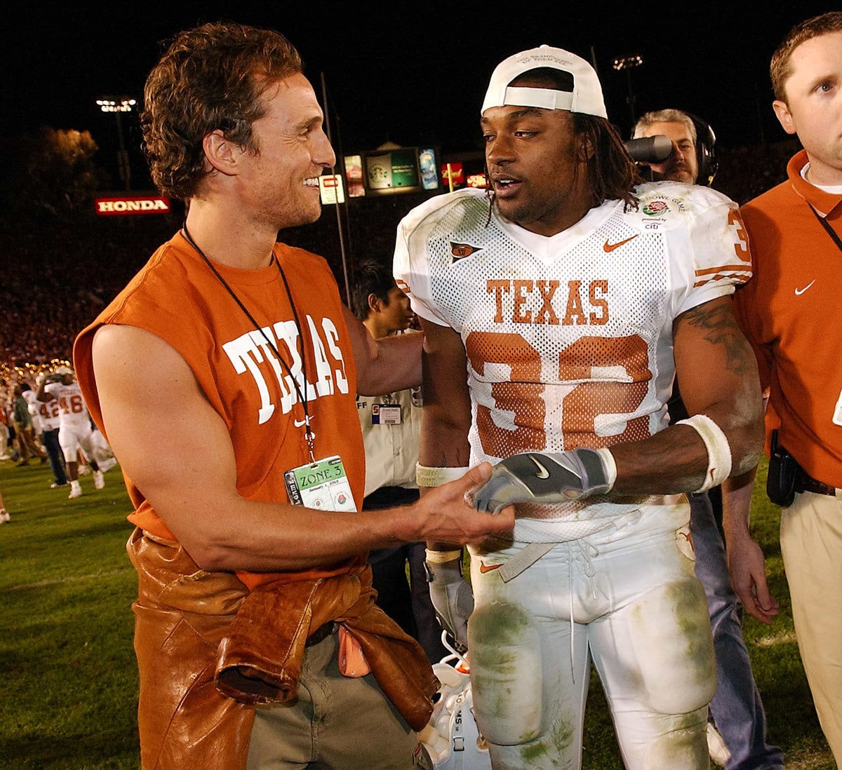 Actor and former Longhorn Matthew McConaughey congratulates Cedric Benson after Texas beat Michigan at the Rose Bowl on Jan. 1, 2005. Deborah Cannon / Austin American-Statesman