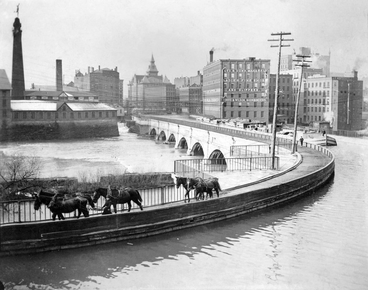 Horses draw a barge across the Genesee River on the Erie Canal aqueduct in Rochester, in this undated photo. Democrat and Chronicle