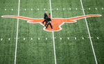 Tom Herman walks to the right of Arthur Johnson, Executive Senior Athletic Director for UT Austin and Athletic director Mike Perrin as they make their way across the field at Darrell K. Royal-Texas Memorial Stadium/Jamail Field before the press conference on Nov. 27, 2016. Ricardo B. Brazziell / Austin American-Statesman