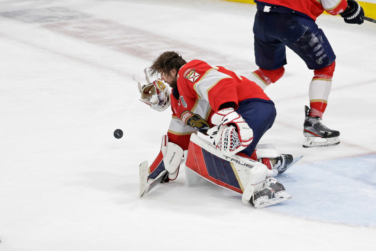 Florida Panthers goalie Sergei Bobrovsky’s helmet falls off as he stops a shot against the Edmonton Oilers during the third period of Game 2 of the 2024 Stanley Cup Final at Amerant Bank Arena in Sunrise on June 10, 2024.