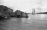 A man watching a wind-powered schooner leave the Plymouth docks, circa 1905. Photo taken by Washington County photographer P. E. Davenport. Courtesy UNC-Chapel Hill, North Carolina Collection Photographic Archives, Wilson Library