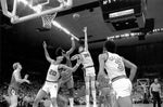 Trail Blazers center Bill Walton (32) goes up for a shot against Chicago Bulls center Artis Gilmore as teammate Maurice Lucas (20) positions himself for a rebound during Game 3 of the first round of the NBA playoffs, April 17, 1977. Roger Jensen / The Oregonian/OregonLive
