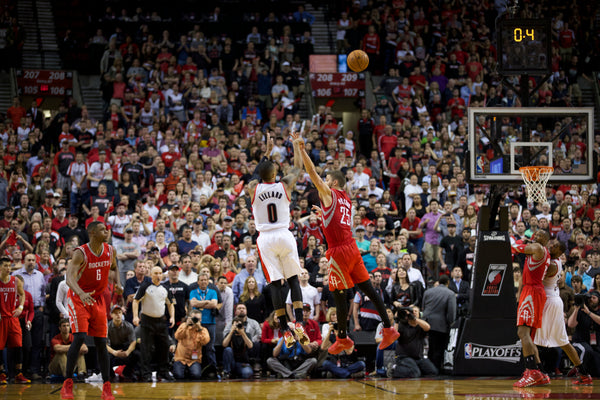 PORTLAND, OREGON - May 2, 2014 - Portland Trail Blazers guard Damian Lillard (0) hits the game winner as the Portland Trail Blazers face the Houston Rockets in game 6 of the NBA playoffs at the Moda Center in Portland, Oregon. Bruce Ely / The Oregonian