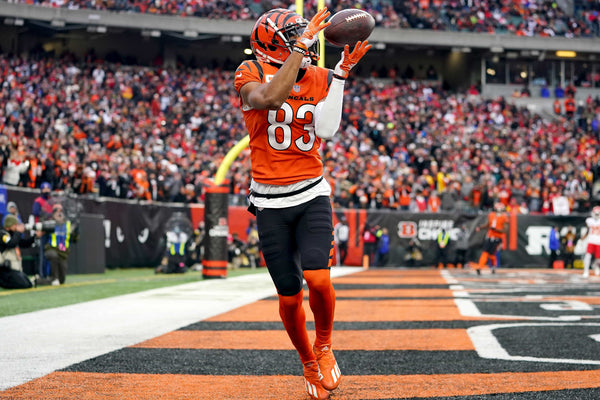 Cincinnati Bengals wide receiver Tyler Boyd (83) catches a go-ahead touchdown pass in the fourth quarter during a Week 17 NFL game against the Kansas City Chiefs, Sunday, Jan. 2, 2022, at Paul Brown Stadium in Cincinnati. The Cincinnati Bengals defeated the Kansas City Chiefs, 34-31. With the win the, the Cincinnati Bengals won the AFC North division and advance to the NFL playoffs. Kareem Elgazzar/The Enquirer