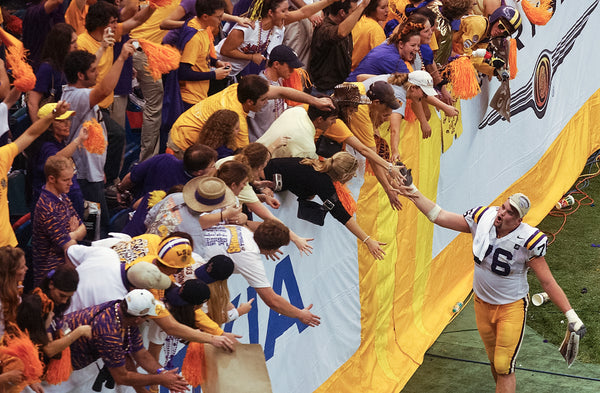 Andrew Whitworth high fives LSU fans in the Superdome after the Tigers beat Oklahoma in the Nokia Sugar Bowl/BCS National Championship Game on Jan. 4, 2004. Patrick Dennis / The Advocate