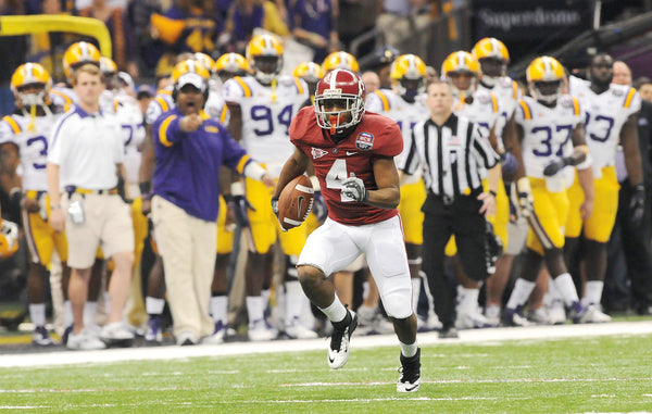 Alabama wide receiver Marquis Maze (4) carries the ball on a 49-yard punt return in the first quarter, the longest against LSU all year, but tore his hamstring on the play.