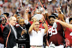 Coach Nick Saban lifts the Coaches' Trophy in recognition of the BCS Championship.