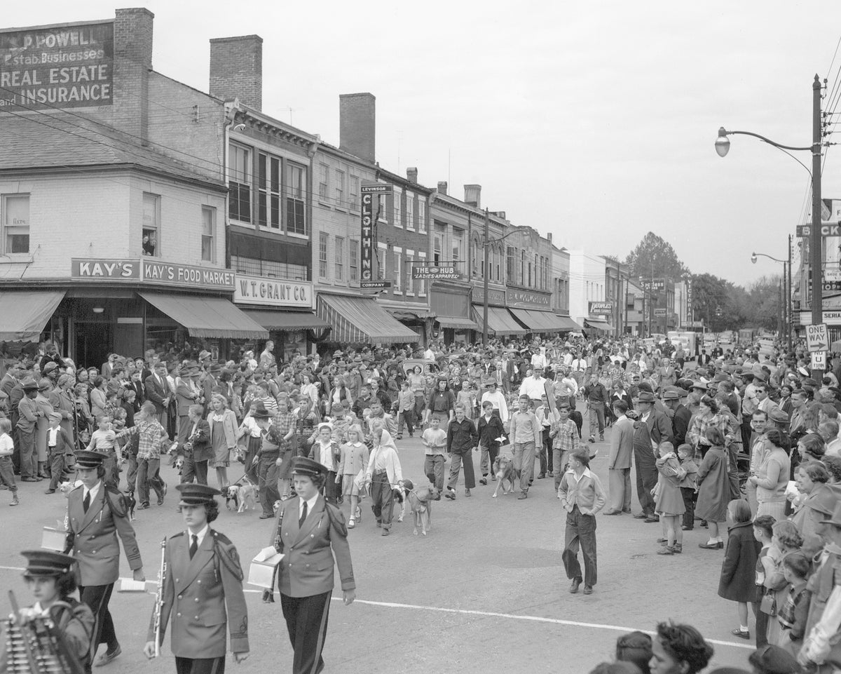 View of a parade traveling through a business district of Fredericksburg during the annual Dog Mart festivities, 1950. Courtesy Library of Virginia, Chamber of Commerce Collection