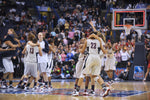 UConn players celebrate on the floor after the Huskies defeated Louisville 76-54 in the 2009 NCAA championship game at the Scottrade Center in St. Louis. Sean D. Elliot / The Day