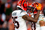 Cincinnati Bengals wide receiver Tyler Boyd (83) celebrates with Cincinnati Bengals wide receiver Tee Higgins (85) after scoring a touchdown in the second half the NFL football game on Sunday, Dec. 19, 2021, at Empower Field in Denver, Co. Cincinnati Bengals defeated Denver Broncos 15-10. Albert Cesare/The Enquirer