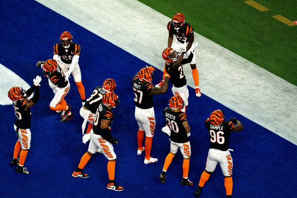 Cincinnati Bengals cornerback Chidobe Awuzie (22) celebrates with other defenders after intercepting a pass in the second half during Super Bowl 56, Feb. 13, 2022. Albert Cesare/The Enquirer