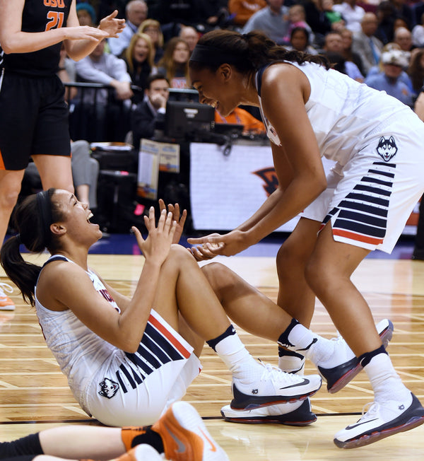 UConn’s Napheesa Collier, left, and Morgan Tuck celebrate after Collier drew a charging call on Oregon State’s Jamie Weisner during the Huskies’ 90-51 victory in the 2016 NCAA Final Four game at Bankers Life Fieldhouse in Indianapolis. Sean D. Elliot / The Day