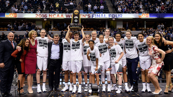 UConn poses with the championship trophy after defeating Syracuse in the 2016 NCAA championship game at Bankers Life Fieldhouse in Indianapolis. Sean D. Elliot / The Day