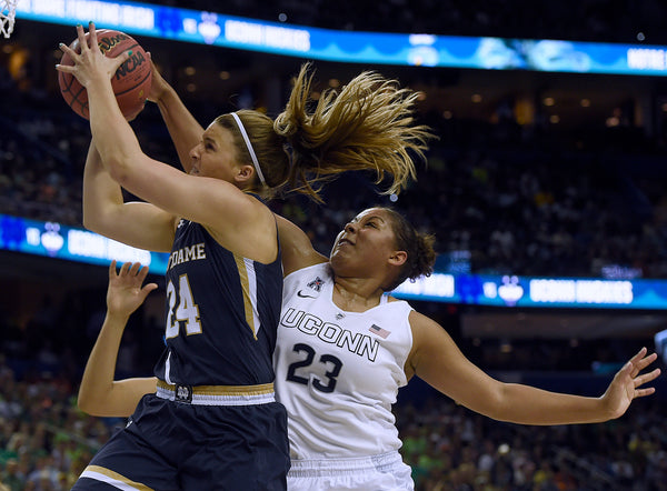UConn’s Kaleena Mosqueda-Lewis comes from behind to get a piece of a shot by Notre Dame’s Hannah Huffman during the Huskies’ 63-53 win in the 2015 NCAA championship game at Amalie Arena in Tampa. Tim Martin / The Day