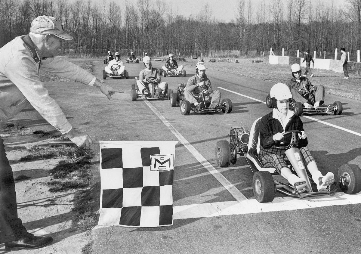 Mrs. Derwood Johnson, the only female member of the Tri-City Go-Kart Club based in Hanover County, finishing first in a club race, December 1961. She gave the trophy to the runner-up because she and her husband had sponsored the race. Still, she had eight trophies, her husband had nine, and their kids added 10 more to the family tally, though they had been racing for only about six months. Courtesy Richmond Times-Dispatch