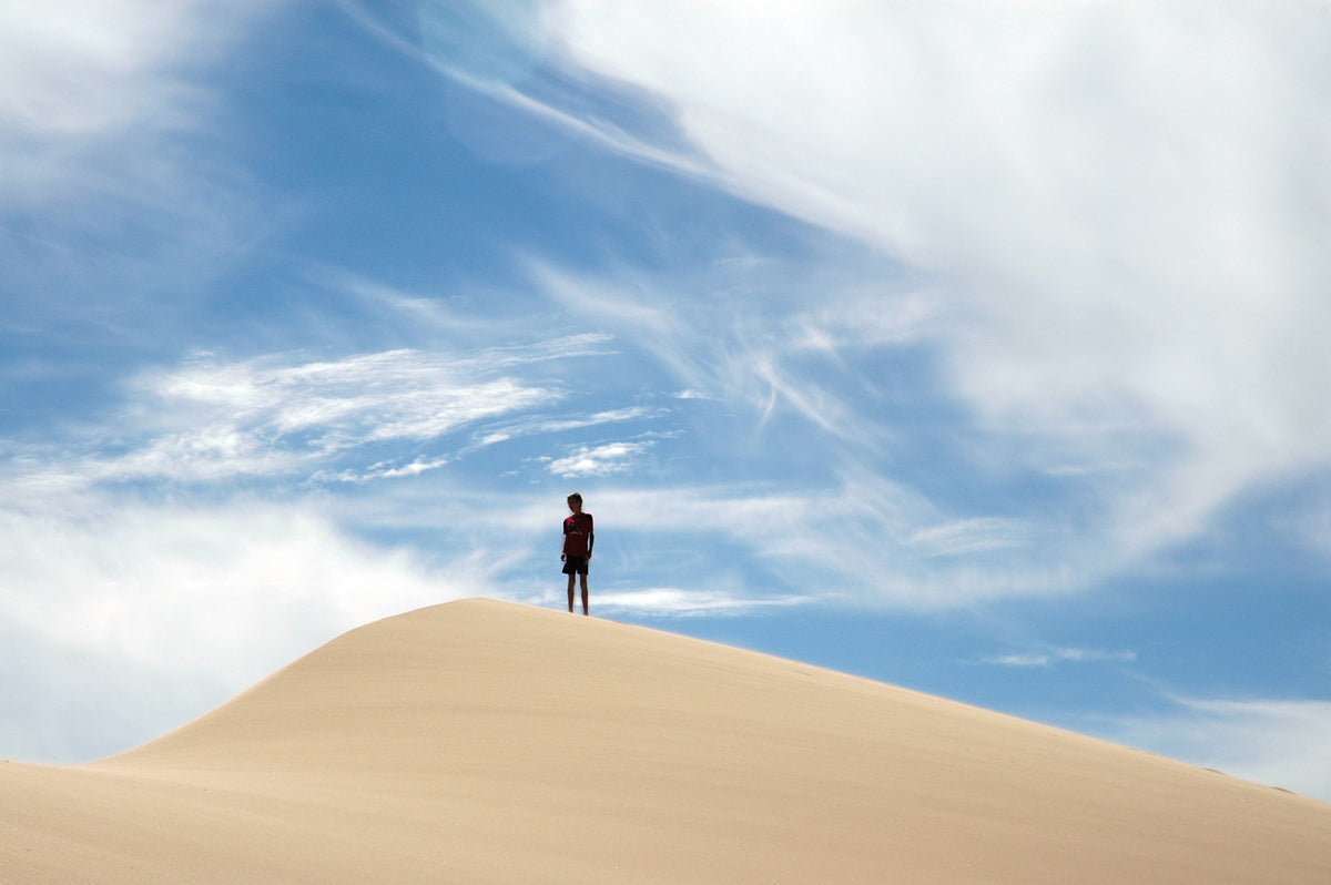 A hiker ascends the Umpqua Dunes on the southern Oregon coast. The area is part of the much larger Oregon Dunes, a 54-mile complex of sand dunes covering roughly 40,000 acres - the largest dune system on the west coast of North America. The sand comes from the nearby Coast Range, once sedimentary rock that was uplifted and carried downstream by rivers. Wind constantly shifts the shape of the dunes, while river currents and ocean tides deposit more sand all the time. Courtesy Terry Richard/The Oregonian