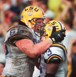 Alan Faneca (66) yells congratulations to Kevin Faulk after he scored a touchdown against Mississippi State on Oct. 26, 1996, in Tiger Stadium. Travis Spradling / The Advocate
