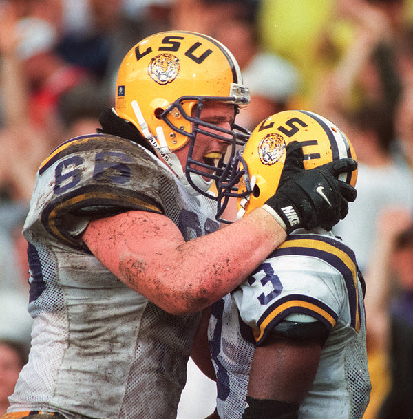 Alan Faneca (66) yells congratulations to Kevin Faulk after he scored a touchdown against Mississippi State on Oct. 26, 1996, in Tiger Stadium. Travis Spradling / The Advocate