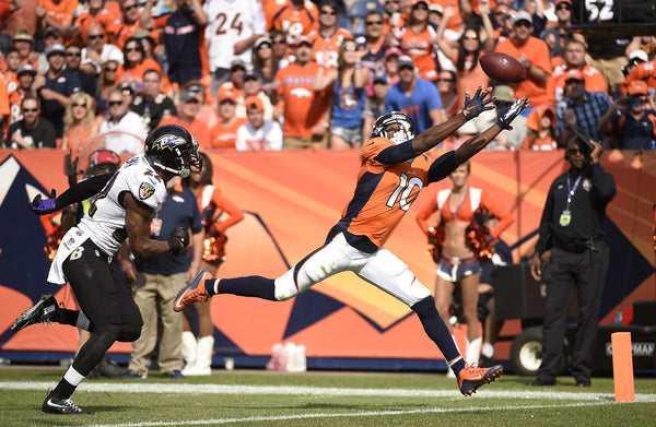 Peyton Manning (18) of the Denver Broncos overthrows Emmanuel Sanders (10) of the Denver Broncos in the end zone during the second quarter. The Denver Broncos played the Baltimore Ravens at Sports Authority Field at Mile High in Denver, CO on September 13, 2015. (Photo by Joe Amon/The Denver Post)