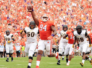 Clemson defensive tackle Carlos Watkins (94) celebrates while running into the end zone after intercepting a pass during the 2nd quarter. Nathan Gray / Anderson Independent Mail