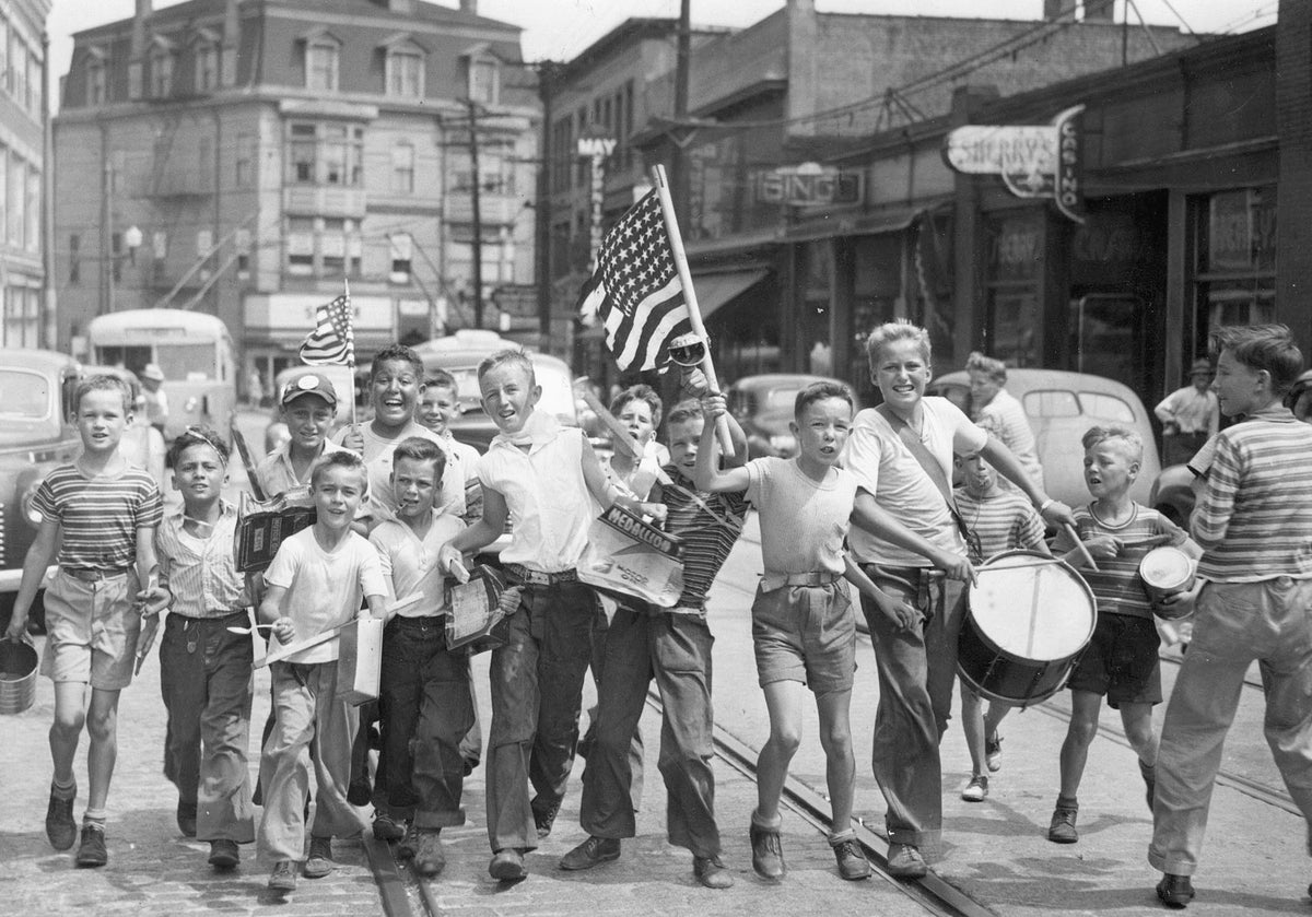 Impromptu victory parade celebrating the end of World War II on Main Street in Pawtucket, August 1945. Included are David Sutton, Norman Thomas, Alfred Thomas, Donald Freda, Norman Tavares, John Sadlier, Donald O’Gara, Jim Welch, Bob “Red” Luther, Joe McCabe, George “Buddy” Young, Phil Moran, Paul Sutton, and Jack “Cy” Welch. Courtesy The Providence Journal