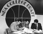Cleveland’s new pro basketball chiefs select their first players in the college draft. From left, assistant coach Jim Lessig, coach Bill Fitch and owner-general manager Nick Mileti check the list of available talent. Charles Harris / The Plain Dealer