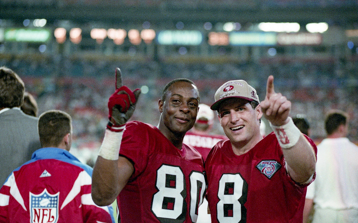 Jerry Rice and Steve Young after the 49ers beat the San Diego Chargers 49-26 to win Super Bowl XXIX, Jan. 29, 1995. Mike Maloney/The Chronicle ^^ center light rgba(40,40,35,0.5)