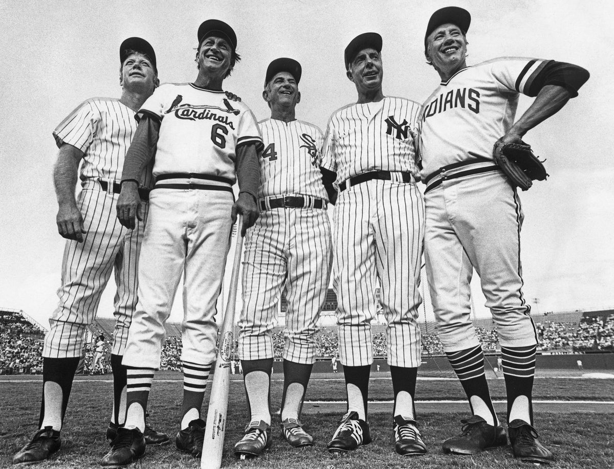 Five Hall of Fame baseball players at the Old Timers game at Arlington Stadium on July 20, 1975. From left: Mickey Mantle (Yankees), Stan Musial (Cardinals), Luke Appling (White Sox), Joe DiMaggio (Yankees), and Bob Feller (Indians). A crowd of 30,706 watched as a group of ex-St. Louis Cardinals won the game 5-2. Courtesy Fort Worth Star-Telegram Collection, Special Collections, UT Arlington Libraries; photo by Al Panzera