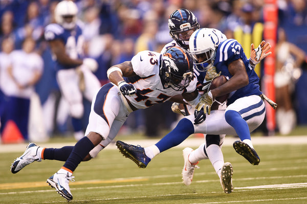 T.J. Ward #43 of the Denver Broncos crushes T.Y. Hilton #13 of the Indianapolis Colts after a first down reception in the first half at Lucas Oil Stadium Indianapolis, Ind. November 08, 2015. (Photo by Joe Amon/The Denver Post)