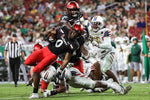 UC's Charles McClelland gains a few yards for UC during the UC Bearcats and South Florida game at Raymond James Stadium on Friday November 12, 2021. UC lead the game at 24-7 by halftime. The Enquirer