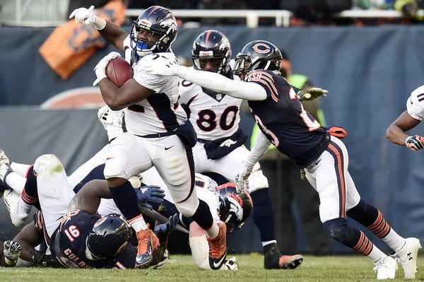 Kyle Fuller (23) of the Chicago Bears cannot tackle C.J. Anderson (22) of the Denver Broncos during the second half of the Broncos' 17-15 win at Soldier Field. The Chicago Bears hosted the Denver Broncos on Sunday, November 22, 2015. (Photo by AAron Ontiveroz/The Denver Post)