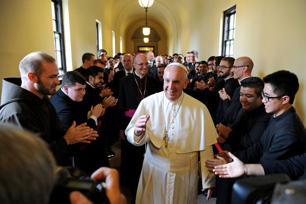 Students of St. Charles Borromeo Seminary greet Pope Francis as he walks the hallway leading to the seminary chapel, where he would speak to a gathering of bishops. Tom Gralish / Staff Photographer