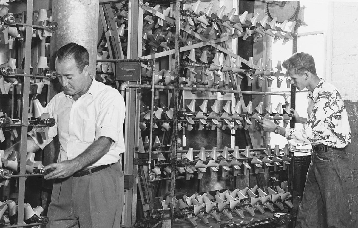 Employees hard at work at the International Shoe Company, circa 1950.