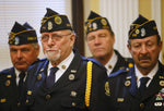 Forty-seven years after receiving wounds that earned him a second Purple Heart for Vietnam combat, Robert Franz, foreground, is joined by his American Legion buddies during the Erie County Hall ceremony to award him the medal.