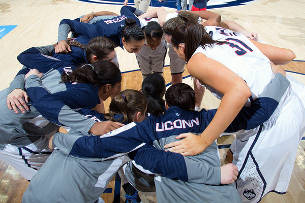 UConn players huddle before a 2014 game at Gampel Pavilion in Storrs. Stephen Slade / UConn